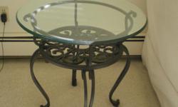 Moving must sell. Glass Side Table w/Wrought Iron Legs. 25 in Diameter x 24.75 Ht. Excellent Condition. REDUCED. $75 or best offer. CASH ONLY. By Appointment only. Serious buyers should send telephone number and address will be provided. Once item is