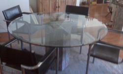 Beautiful round glass table and 6 leather and chrome chairs, including the matching side board for sale.
Table is round 55 inches in diameter
height 28 inches
sideboard top is glass and measures approximately 51 inches long, 15 inches deep and 28 inches
