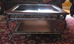 Glass Top Coffee Table & (2) matching End Tables from the Ashley Millennium collection. Glass on coffee table has slight nick in 1 corner. These tables are very heavy and are in excellent condition! These tables were originally purchased for our home in