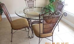 Round glass top table with four chairs.&nbsp; Excellent conditon, paid $1100,&nbsp; asking 400.00&nbsp; Please call 325-949-2989