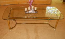Practically New! Polished gold brass bevelled glass coffee table, Perfect for living room, family room, or den, will enhance any room. Best offer (50L x 24W) clean home, no pets, or kids. email for details.