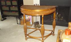 Unique Half Round Wicker and Ratan Table. Very good condition.&nbsp; 30 1/2" Long, 30 1/2" Tall, 17" Deep.