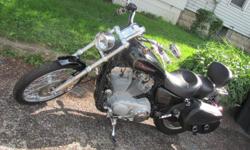 Must see bike. 7400 miles. No dents or scratches. Sportster hardside saddle bags. Runs and looks likes new. Cash or cashiers check only.