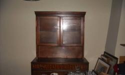 Hutch/ Only the top piece with two shelves and the glass front is for sale.
Location 3rd Ave and Medlock Dr