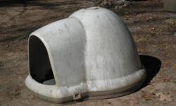 This is a doghouse in the shape of an igloo. It is for a medium to large dog. It is 31 " high X 3' wide X 4' long. The door is 18" X 18".The finish is stained by the weather but could be painted. A great shelter for Fido. Please call 624-3918.