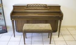 Kimball Exclusive Tone Action upright piano with matching bench. In good condition, and all working keys.