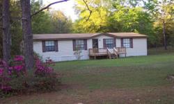 Double wide mobile home located on a large lot- ideal for entertaining or a get away at the lake.
Central heat/air, large walk-in closets. New carpet and hardwood. New hot water heater. Dishwasher, refrigerator, stove provided.