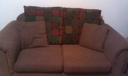 Chocolate brown loveseat with accent pillows, in pretty good condition. No holes, rips or tears. Cash only.