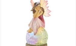 A bright-eyed fairy crouches delicately upon a crystal orb, enchanted by its magical light show. Color-change LED lights give this figurine a captivating rainbow glow!
Weight 0.4 lb. Polyresin and plastic. Three AG3 button cell batteries not included. 2?"