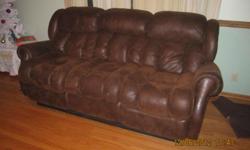 Brown leather sofa with two end recliners. Matching loveseat with two recliner/rockers