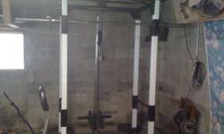 Squat rack with multiple uses. It has of course the squat bar and weights. a pull up bar. a bar that pulls down from the top and a handle on the bottom that pulls up (dont know tech terms for those) in good shape with a few scratches. Its a Club Weider