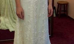 I have a never been worn size 12 wedding dress. I called off the wedding and have no use for it and dont want it sitting in my closet anymore. It is and all of the beads are all in tact. I am 5'9 and it still had to be altered on the bottom and taken up