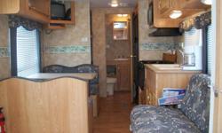 It is in EXCELLENT condition, very clean, never smoked in and tows easily with a 1/2 ton pickup. This is a one owner camper we bought it new. It has a queen bed in a front bedroom with sliding doors and three bunks in the back. Rear bathroom with vanity,