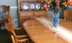 Large Solid Oak Dining Table, 8 chairs, two extra leaves and matching hutch with lots of storage. $700.00 OBO