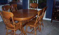 Oak dining table with leaf, four regular chairs and two captians chairs. Well made, hardly used. Pictured without leaf (oops, forgot to add before taking pics!).
