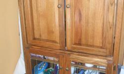 Solid oak entertainment center, excellant condition paid $600.00 will take $300.00
