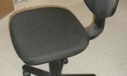 Office chair. Swivels and adjusts forward and back.