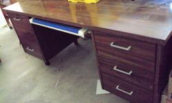 Nice Desk -- has pencil drawer with wrist pad - that's the blue thing you see in the picture.
Great shape - There were boxes on top when I took the picture, but the top is in great shape. $40.00
This is a great chair, very well made, swivels, and rocks