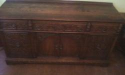 THIS IS A 1930S OAK HAND CARVED BUFFET TUDOR STYLE/ENGLISH WITH DINING ROOM TABLE VERY NICE ETCHING AND NO CHAIRS WITH TABLE BUT IM ASKING $1200.00 THESE ARE NICE PIECES FOR A COLLECTOR OR RESELLER CHRIS AT 561-995-2800