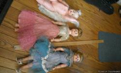 really old dolls about 2' long and a box of really old barbies