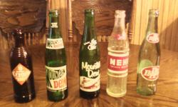 Pictured left to right. CRUSH 1954 - $10; MOUNTAIN DEW 1978 - $5; MOUNTAIN DEW 1950's - $10; HEHI 1972 - $5; DR PEPPER 1971 - $5.Take all for $30.