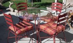 This is a beautiful red wrought iron set. It could be used in an outdoor living space, or interior. This is a great deal!!
