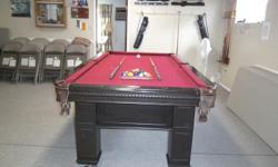 8 ft. AMF pool table with 2 sticks, balls and rack and wall rack.