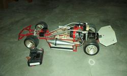 Custom made Quarter scale race car built for paved oval racing.&nbsp; Pan type chassis with RACO independent&nbsp;front and rear suspension.&nbsp; The rear end has quick change gear set.&nbsp; The engine has a tuned pipe and&nbsp;is strong and has not