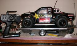 Rc 1/10 Scale Short course truck raced 1 time. It has a new 3300kv ce Brushless motor and a new xp-sc450-bl ESC
4 new caliper tires and rims and a extra set of tires and rims and a 3000 duartrax battery very fast not enough room where i live to run. the