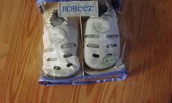 Robeez baby shoes, size 6 to 12 months. These are a white sandal style. In very good condition.