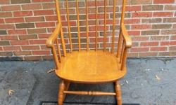 This is an exceptional wood rocking chair. Solid as a rock and 100% real wood. Cushion is included. Stands: 40 inches tall and seat measures: 21" X 19". A real beauty . Will be great for mom and new baby. First to look will grab this rocker and run. First