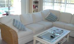 Sectional Couch - White with 6 throw pillows, 3 white and 3 are blue/whte/green. Sides are rattan weave, very deep couch, only 3 years old. Coffee table and end tables are white with glass insert in middle and green/blue tile border around glass insert,