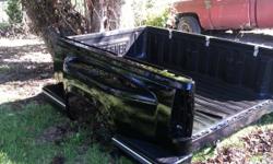This is a black short bed step side GMC truck bed. It has a tuff liner. It is in good shape. It does need tail lights, but all plugs are still good.&nbsp;This bed came off&nbsp;of 2000 GMC pick up truck. &nbsp;Tail gate not shown but I do have it. May