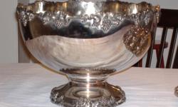 This beautiful grape pattern is silver plate with gold wash. Sets are getting harder to find. The bowl is 10" tall and 15" across. 12 footed, handled cups. Can be used at home, for weddings, in church, bed and breakfast and as a family heirloom. One