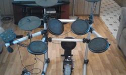 Drum kit with foot pedal and drum amp. Hardley used. I can text picture.