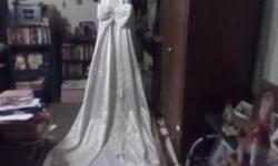 Wonderful for the big day! has long train and veil. Must see to fully appreciate. call anytime to see or try on.
