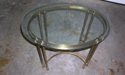 This glass table has a metal base. The glass is 3/4 thick so it is moderately heavy. It is 29-1/2 inches long by 21 inches wide by 23 inches high. Will not ship, Massachusetts residents only. If interested reply to dvalanzo@yahoo.com