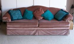 Taupe sofa and loveseat, in great condition with matching and contrasting throw pillows.