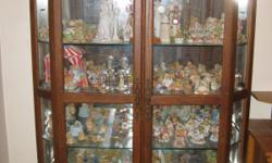 Solid Oak Curio Cabinet. Paid over $1000.00 but will take $400.00. 6 thick glass shelves to store your collectibles on. Cabinet has two lights on the top and one underneath the bottom glass shelf.