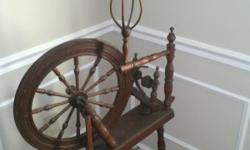 18th century flax spinning wheel in pristine condition.