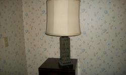 An extremely heavy square lamp with squares on all sides and appears to be chess pieces on two sides.&nbsp; The shade and the lamp are used, in good condition,&nbsp;the cord is also good.&nbsp; Call - in Springfield, IL for an appointment.&nbsp; Asking