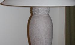 Beige lamp (looks like limestone with a beige lamp shade) it's in good condition.