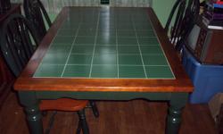 green tile top table with four chairs
