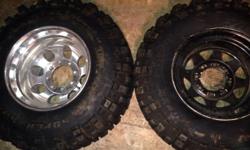 4 33x12.5 tsl super swampers. 2 mounted on new offset Mickey thompson 16.5x10 wheels. Two on steel wheels. Barely used like new