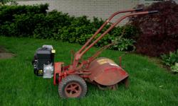 Troy-Built Tiller (an old one), 22 inch width, with Briggs & Stratton 8Â¾ hp engine, engine has less than 10 hours, no leaks