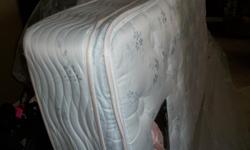 Pillow top twin mattress and box spring in great condition. Complete with frame and oak headboard.