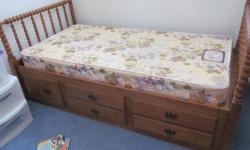 Twin Storage Bed and Mattress. Bed frame has 4 drawers and 1 large cabinet for holding bedding, toys, clothes, or? Made of solid wood, sturdy and in great condition. Has always been in a non smoking environment, clean! Bed measures 79" x 42". Bed frame