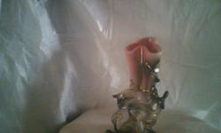 Its a very prety deer vase, Ive researched it, it cost $75.00 on line. It is a fawn with its mother with gold trim. Like new.