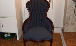 victorian chair navy blue with mahogany trim with carved roses.Good condition.