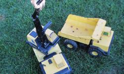 *~*~* These are Older Vintage Yellow Dump Truck and Tractor. They do have some rust on them from age but could be sanded down and re painted if you wised to do so. The Tractors these are getting hard to find.. They are both from a smoke free home..We have